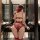Woman wearing qqny sexy lingerie set for small bust, featuring a seductive red lace design with garter straps and a matching ...