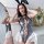 Sexy rabbit girl costume bodysuit featuring backless design and strappy lingerie style, perfect for cosplay with elegant ruff...