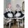 Two cosplayers dressed as ram and rem from re:zero, wearing maid outfits in lolita style. black and white dresses with ruffle...