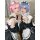 Two cosplayers dressed as ram and rem from re:zero, wearing maid outfits in lolita style anime cosplay dress.