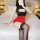 A woman poses on a bed wearing a black and red ranqing seductive lingerie set, featuring a hot sheer office secretary outfit ...