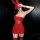 Woman in red lace bunny lingerie set with crop top, mini dress, and matching stockings for cosplay or holidays.