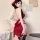 Woman wearing red chinese-style floral lingerie robe with vintage peony embroidery, halter neck, and lace cutouts.