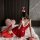 Sexy low-cut red christmas-themed lingerie dress with festive santa hat, perfect holiday costume.