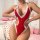 Woman wearing red lace bikini set with sheer mesh, sexy valentines day outfit, no-remove design, posing in bedroom.