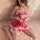 A woman wearing a red maid costume dress, featuring lace details, bows, and ties, perfect for an ol-style princess look at a ...