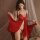 Red new year sensual lingerie featuring a seductive open-crotch robe, perfect for couples play with intricate lace details an...