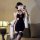 A woman poses in a retro chinese-style dress featuring lace detailing, high slits, and a bare-back design, complemented by st...