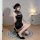 A woman poses on a circular rug wearing a black retro chinese qipao lingerie set, featuring a sexy high-slit design, lace-up ...