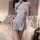 Woman wearing a silver retro chinese qipao lingerie set with a vintage split-hem short dress design.