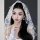 Elegant white lace veil with delicate bows, perfect for adding a touch of french chic to any brides look for photoshoots and ...