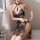 Sexy vintage-inspired lace cheongsam sleepwear set featuring buttoned design, sheer cutouts, and tassels for elegant allure.