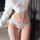 Sexy lace thong for women featuring low-rise design, cross-cut style with delicate bow detail, perfect for pure temptation.