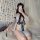 A woman poses with a fan, wearing a ruolan sexy oriental lingerie set featuring a japanese-inspired split-back kimono style o...