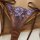 Sheer brown lingerie panty with purple floral lace detailing and satin trim, part of the russian lace premium french-style se...