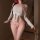Woman modeling sakura passion lingerie set: sheer white top with pink wet-look bikini, bow details, seductive sleepwear ensem...