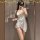 Woman wearing white satin sleep dress with ties, posing in mirror. alluring summer lounge lingerie nightgown for women.