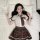 A young woman models a schoolgirl costume set featuring a white blouse with a plaid tie and matching pleated skirt, embodying...