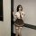 A stylish schoolgirl costume set featuring a white blouse, plaid skirt, tie, and stockings, perfect for a playful and allurin...