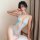 Woman wearing a seductive light blue lace nightwear set with sheer mesh, floral trim, and push-up bra details.