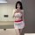Seductive lace bodysuit and micro mini skirt set with bold red accents, designed for passionate play.
