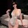 Seductive lace bodysuit featuring sheer cut-out design, open-crotch style, and removable pads for sensual allure.