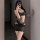 Woman wearing black lace bodysuit with open-crotch design, posing in mirror selfie. sensual sleepwear and playful lingerie se...