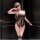 Woman wearing black lace bodysuit with sheer mesh, cut-out details, and thigh-high stockings. part of the pure allure collect...