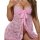 Woman wearing pink lace butterfly bow push-up lingerie with open-crotch design for small bust.