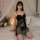 Woman in black lace sheer chemise with built-in pads, kneeling on bed with candles and flowers. modest yet sexy sleepwear for...