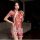 Woman wearing a red floral embroidered seductive maid costume lingerie set with sheer fabric and white lace trim.