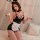 Seductive maid costume lingerie set with black shiny dress, white apron, bunny ears, and wrist cuffs for alluring sleepwear.