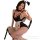 Woman in black patent leather maid lingerie with bunny ears, white apron and cuffs, posing seductively on chair.