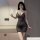 Woman wearing shiny v-neck sheer lace nightgown, bodycon slip dress with sparkling details, elegant lingerie for women.