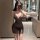 Woman wearing a seductive v-neck sheer lace nightgown, a shiny bodycon slip dress for women, taking a mirror selfie in a mode...