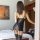 Seductive open-crotch bodysuit with lace detailing and fishnet stockings set, featuring a tear-away mesh design for sensual a...