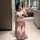 Woman kneeling in bathroom wearing white and red open-crotch bodysuit with lace trim, perfect for couples nightwear.
