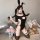 Seductive open-crotch bodysuit set featuring a stylish black design with cutouts, perfect for sleepwear or themed outfits. in...