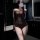 Woman taking mirror selfie in brown lace mesh lingerie set with sheer see-through panels and long sleeves.