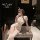 Woman in white lace qipao lingerie set with bunny ears, posing seductively on bench — forbidden elegance sleepwear for couple...