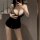 Seductive black bodycon skirt with plunging neckline, perfect for curvy women seeking a flirty and bold date night outfit.