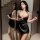 Seductive black bodycon skirt with deep neckline, perfect for curvy women seeking a flirty and elegant date night outfit.