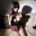 Woman in seductive restraint-style lingerie set with leather-look top, plaid bow & skirt, fishnets, bunny ears — no-remove de...