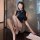 A stylish woman poses with a high-waisted bodycon skirt set, featuring a sleek top and elegant design, perfect for an office ...