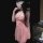 Woman wearing pink sheer lace sleep dress with underwire support, floral details, and matching eye mask.