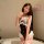 Woman modeling a black and white striped maid-style lingerie set with ruffles, buttons, and a choker. perfect for role play o...