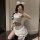 Woman in white sailor-style lingerie set with fluffy ears, posing playfully for mirror selfie — modest yet sexy student-inspi...