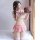 Woman in pink plaid student uniform lingerie set holding a strawberry cake, playful tease outfit for passion.