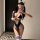 Woman in navy blue and white lingerie set with cat ears, posing seductively while taking a mirror selfie.