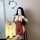 Woman modeling a red semi-sweet lace lingerie set with sheer mesh and gold chain details in a mirror selfie.